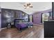 Spacious bedroom with a statement wall and a ceiling fan at 650 Woodman Dr., Conway, SC 29526