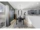 Dining area with modern light fixture and access to kitchen and sliding glass door at 650 Woodman Dr., Conway, SC 29526