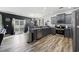 Stylish kitchen featuring stainless steel appliances, gray cabinets, and wood-look flooring at 650 Woodman Dr., Conway, SC 29526