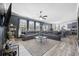 Open-concept living room with dark walls, gray sofa, and lots of natural light at 650 Woodman Dr., Conway, SC 29526
