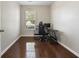 Bright and modern office space with hardwood floors, natural light, and sleek black desk at 650 Woodman Dr., Conway, SC 29526