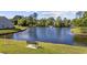 Scenic pond view with fountain feature surrounded by lush landscaping at 650 Woodman Dr., Conway, SC 29526