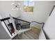 Bright staircase featuring neutral carpet and views of the yard out the large window at 650 Woodman Dr., Conway, SC 29526