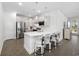 Modern kitchen with stainless steel appliances, white cabinetry, and a stylish breakfast bar for casual dining at 6562 Torino Lane, Myrtle Beach, SC 29572