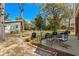 An outdoor space with patio furniture, a fire pit, and a detached structure offers a relaxing backyard oasis at 710 Yucca Ave., Myrtle Beach, SC 29577