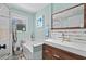 Cheerful bathroom featuring a combination tub/shower, a bright color palette and wood vanity at 710 Yucca Ave., Myrtle Beach, SC 29577
