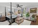 Stylish bedroom with dark wood flooring, four-poster bed, and neutral decor at 710 Yucca Ave., Myrtle Beach, SC 29577