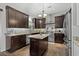 Modern kitchen with dark wood cabinets, stainless steel appliances, granite countertops and eat-in island at 710 Yucca Ave., Myrtle Beach, SC 29577