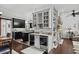 Open concept kitchen features black cabinetry, wine fridge, and seamless access to dining and living rooms at 710 Yucca Ave., Myrtle Beach, SC 29577