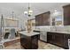Open concept kitchen with granite countertops, eat-in island, and stainless steel appliances at 710 Yucca Ave., Myrtle Beach, SC 29577