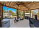 Outdoor patio with a stylish wood ceiling, string lights, and comfortable seating area at 710 Yucca Ave., Myrtle Beach, SC 29577