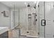 Luxurious walk-in shower with pebble tile flooring, bench seating, and dual shower heads at 710 Yucca Ave., Myrtle Beach, SC 29577