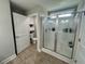 Bathroom showing a glass-enclosed shower and adjacent toilet nook with storage at 7370 Johnson Shortcut Rd., Conway, SC 29527