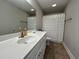 Bathroom with single vanity, white countertop and decorative shower curtain at 7370 Johnson Shortcut Rd., Conway, SC 29527