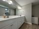 Bright bathroom featuring a double vanity with a white countertop and modern fixtures at 7370 Johnson Shortcut Rd., Conway, SC 29527
