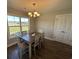 Bright dining area with a wooden table set, and a large window with natural light at 7370 Johnson Shortcut Rd., Conway, SC 29527