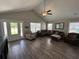Bright, open living room featuring vaulted ceilings, hardwood floors, and comfortable seating at 7370 Johnson Shortcut Rd., Conway, SC 29527