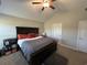 Spacious main bedroom with a vaulted ceiling, and a large bed with a stylish headboard at 7370 Johnson Shortcut Rd., Conway, SC 29527