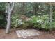 Beautiful backyard with flowering shrubs and a stone paver landing at 880 Briarwood Dr., Myrtle Beach, SC 29572