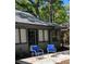 A gray house exterior with a backyard patio and chairs at 880 Briarwood Dr., Myrtle Beach, SC 29572
