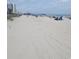 Ocean view of a beach with people, pier and buildings in the distance at 880 Briarwood Dr., Myrtle Beach, SC 29572