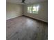 Spacious bedroom with hardwood flooring, ceiling fan, and natural light at 880 Briarwood Dr., Myrtle Beach, SC 29572