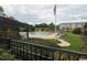 A community pool with tables and chairs next to a grassy common area at 880 Briarwood Dr., Myrtle Beach, SC 29572