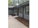 Side view of home exterior with patio and well-maintained landscaping at 880 Briarwood Dr., Myrtle Beach, SC 29572