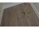 Close up of durable, stylish hardwood flooring with white trim at 880 Briarwood Dr., Myrtle Beach, SC 29572