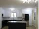 Bright kitchen with stainless steel appliances, island, and stylish marble backsplash at 880 Briarwood Dr., Myrtle Beach, SC 29572