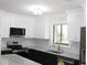 Modern kitchen features white cabinets, stainless steel appliances, and marble countertops at 880 Briarwood Dr., Myrtle Beach, SC 29572