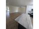 Open floor plan showing the living room with wood floors connecting to kitchen area at 880 Briarwood Dr., Myrtle Beach, SC 29572