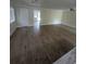 Bright living area with hardwood floors, a ceiling fan, and natural light streaming through windows at 880 Briarwood Dr., Myrtle Beach, SC 29572