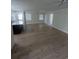 Spacious living room with wood flooring and natural light, open to kitchen area at 880 Briarwood Dr., Myrtle Beach, SC 29572