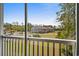 Balcony view overlooking well-maintained lawns, building exterior, and parking at 948 Jackline Place # 201, Murrells Inlet, SC 29576