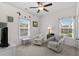 Comfortable bedroom showcasing two chairs, a window and ceiling fan at 948 Jackline Place # 201, Murrells Inlet, SC 29576