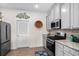 Grey cabinets, granite countertops, and stainless steel appliances in the kitchen at 948 Jackline Place # 201, Murrells Inlet, SC 29576