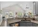 Kitchen with granite counters, a breakfast bar, and views of the living area at 948 Jackline Place # 201, Murrells Inlet, SC 29576