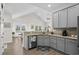 View of the open kitchen, dining, and living area with vaulted ceilings and an open floorplan at 948 Jackline Place # 201, Murrells Inlet, SC 29576