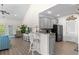 Open kitchen area, including breakfast bar and stainless steel appliances at 948 Jackline Place # 201, Murrells Inlet, SC 29576