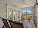Inviting screened porch with seating area, perfect for relaxing outdoors at 948 Jackline Place # 201, Murrells Inlet, SC 29576
