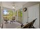 Screened porch with comfortable seating offering peaceful views of the surrounding landscape at 948 Jackline Place # 201, Murrells Inlet, SC 29576