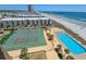Aerial view of a condo complex with a pool, tennis court, and beach access at 9650 Shore Dr. # 810, Myrtle Beach, SC 29572
