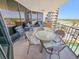 Comfortable balcony with table, chairs, and ocean views from a high-rise condo at 9650 Shore Dr. # 810, Myrtle Beach, SC 29572