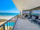 Spacious balcony with chairs and ocean views overlooking the pool and beach at 9650 Shore Dr. # 810, Myrtle Beach, SC 29572