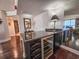 A bar area features a wine cooler and dark wood floors at 9650 Shore Dr. # 810, Myrtle Beach, SC 29572