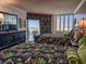 Comfortable bedroom with two beds, dresser with a TV, and access to a private balcony at 9650 Shore Dr. # 810, Myrtle Beach, SC 29572