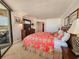 Cozy bedroom with a comfortable bed, dresser with TV, and a private balcony at 9650 Shore Dr. # 810, Myrtle Beach, SC 29572