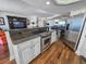 A kitchen boasts granite counters, stainless steel appliances, and wood floors at 9650 Shore Dr. # 810, Myrtle Beach, SC 29572