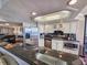Modern kitchen with stainless steel appliances, granite countertops, and ample cabinet space at 9650 Shore Dr. # 810, Myrtle Beach, SC 29572